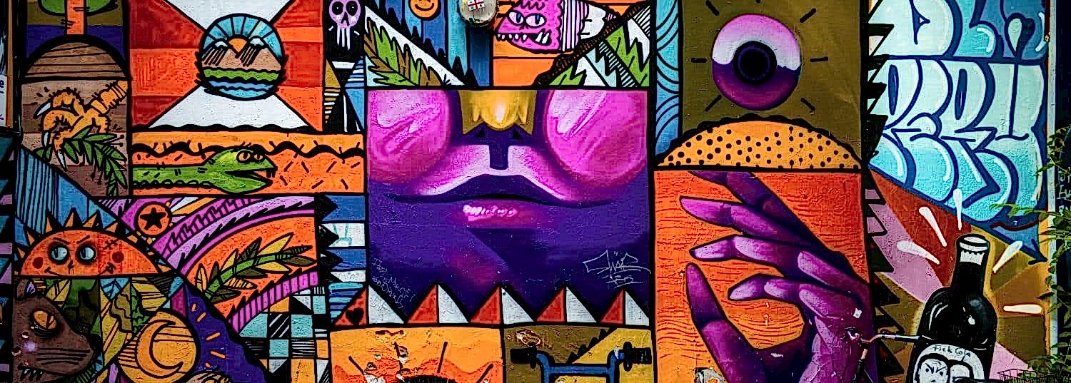 colorful and vibrant street mural on a wall in berlin, germany